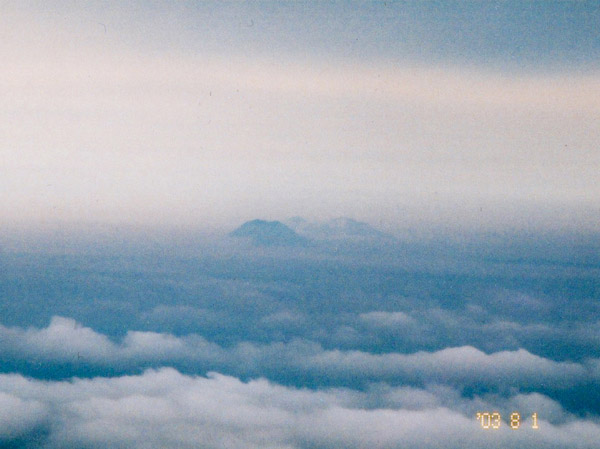 photo 雲海の向こうに雄阿寒、富士、雌阿寒
